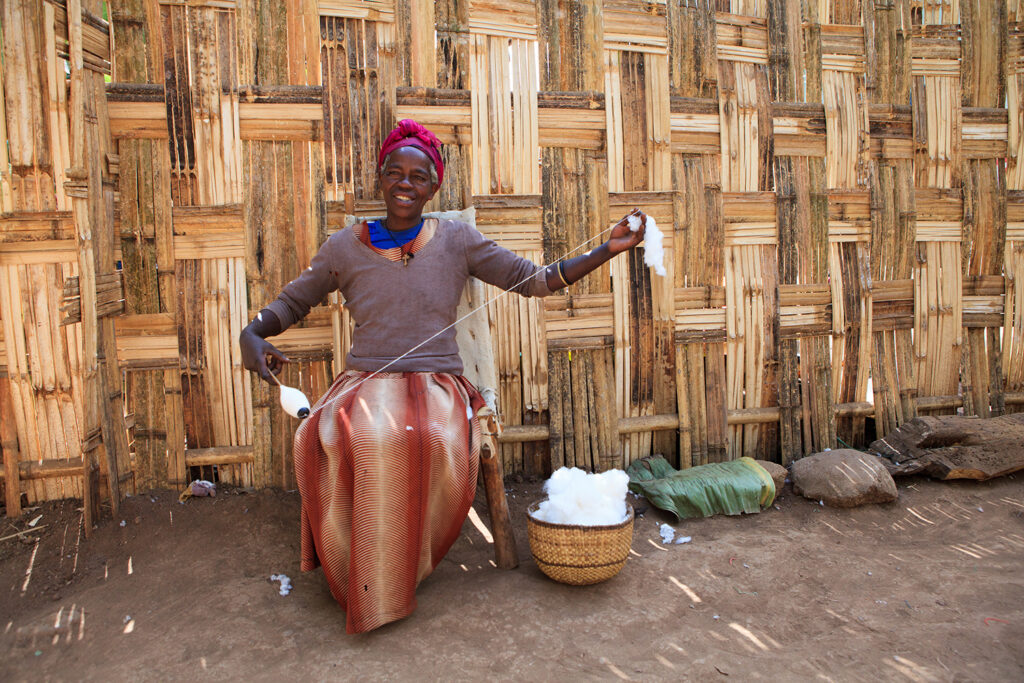 Women making textile TIE