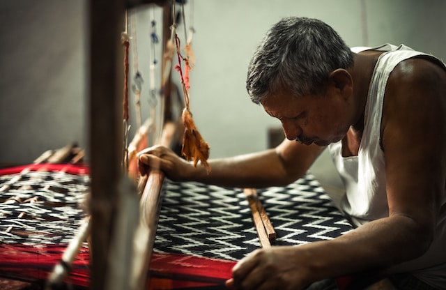 photo of an artisan making textile